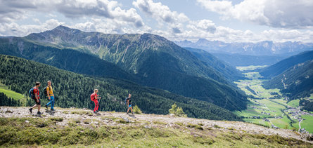 Summer landscape and walkers having a great view on the Gsieser Tal valley.