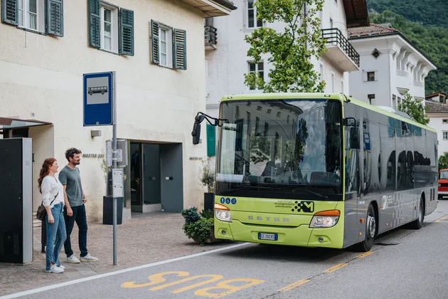 A bus waiting at the bus stop