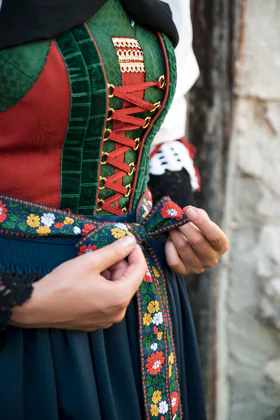 A woman with children wearing traditional clothing