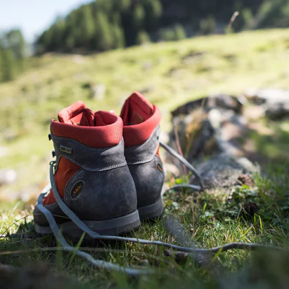 Hiking boots on a stone in the South Tyrol mountains