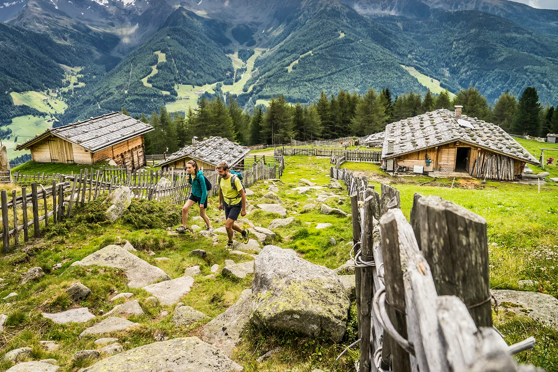 Two people hiking through the Ahrntal valley