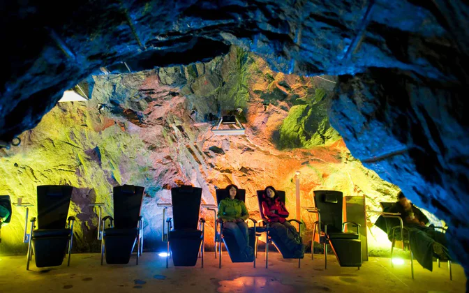 People unwind in the Prettau climatic gallery in the Ahrntal valley