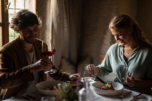 A woman and a man having a romantic dinner