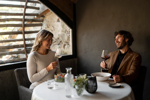 A couple drinking wine in restaurant