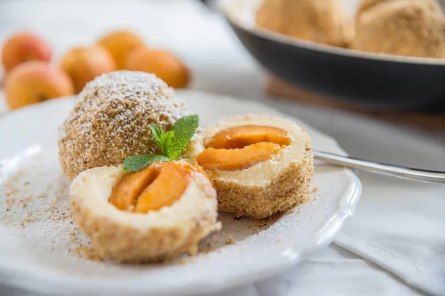 Apricot dumplings with breadcrumbs fried in butter