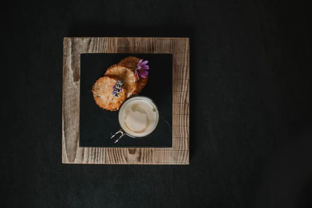 Celeriac cappuccino with a baked apple-and-quark raviolo