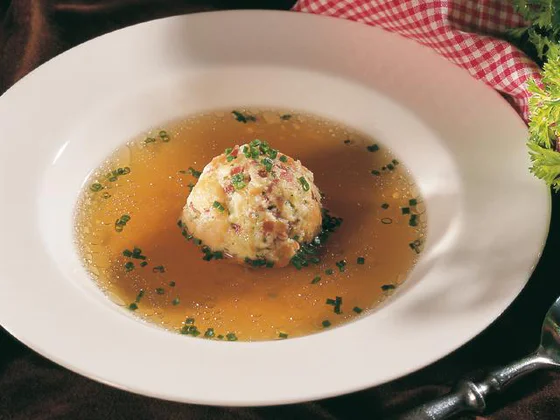 Speck-flavoured dumplings in beef broth