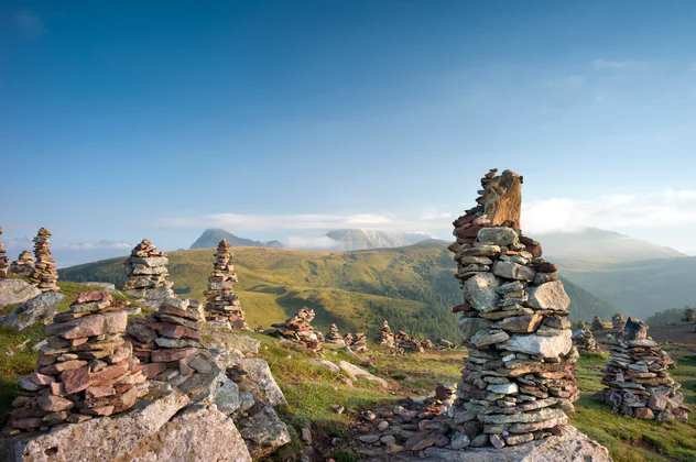 Cairn in the Sarntal valley against a blue sky