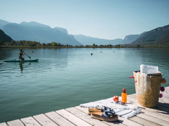 View of the Kalterer See lake from the bathing jetty.