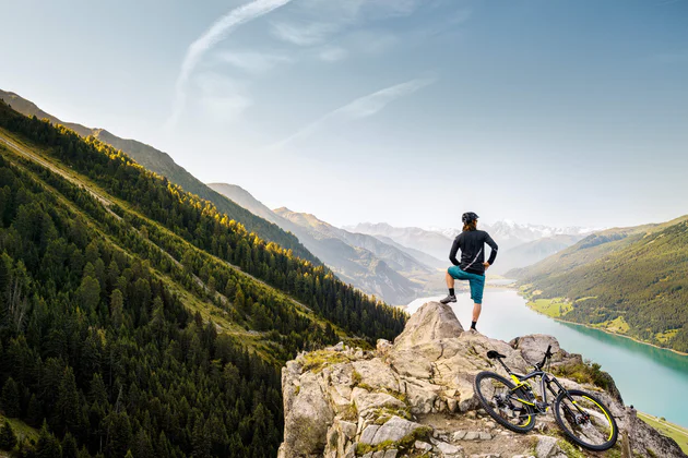 A person stares at a distant mountain range 