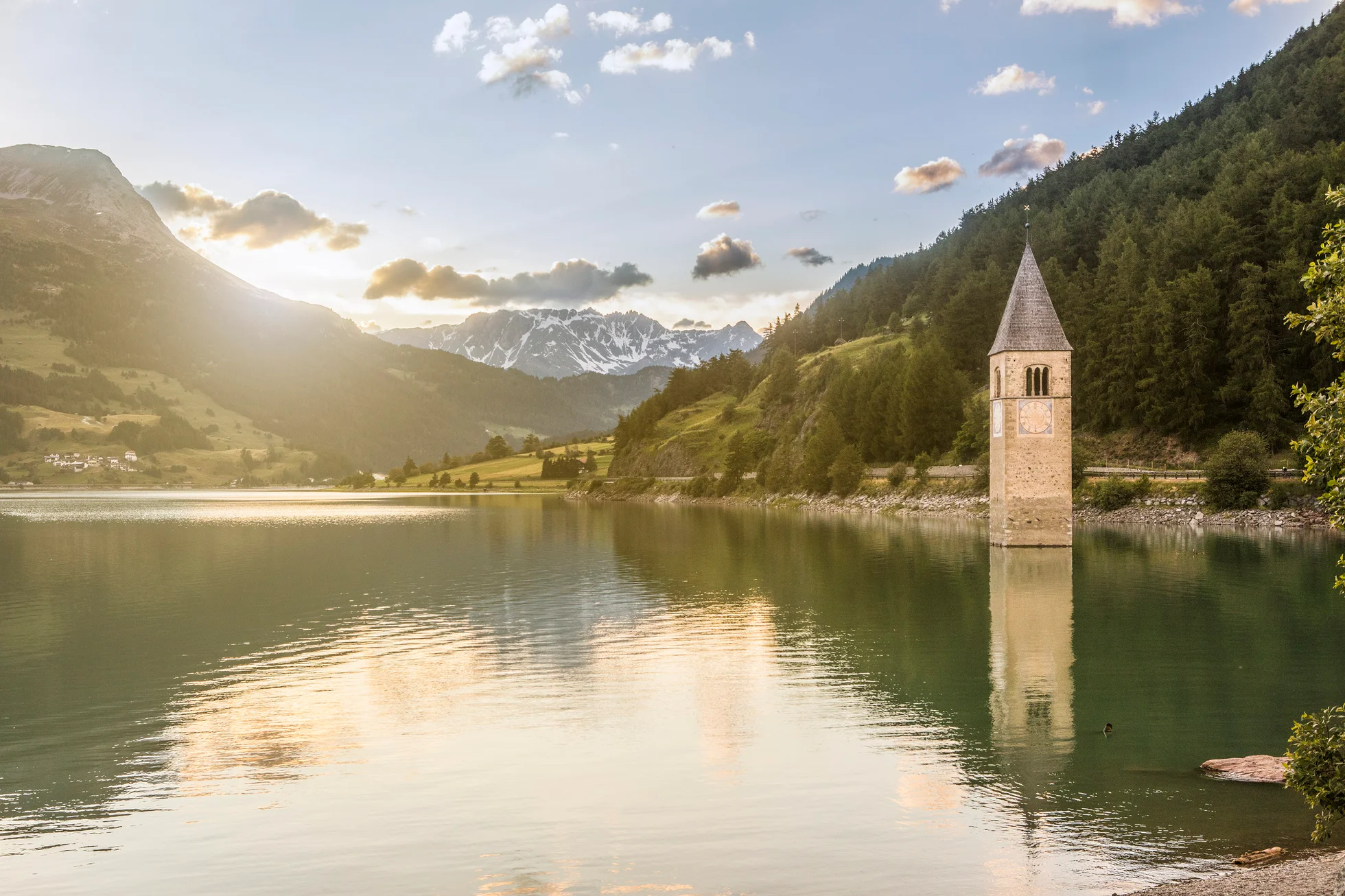 The Reschensee lake with its church spire in the submersed town of Alt-Graun.