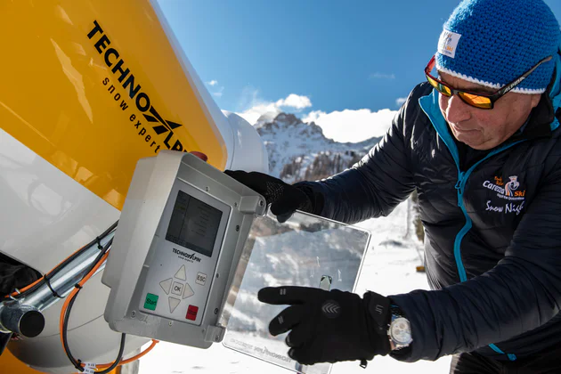 TechnoAlpin founder Georg Eisath operates one of his company's snow cannons in a ski resort. 