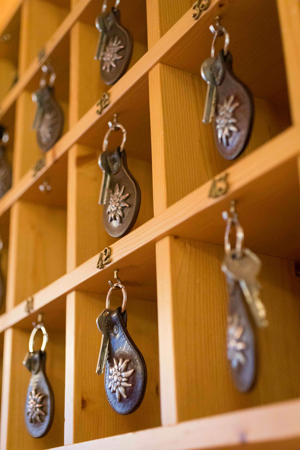 Many room keys hanging in a hostel