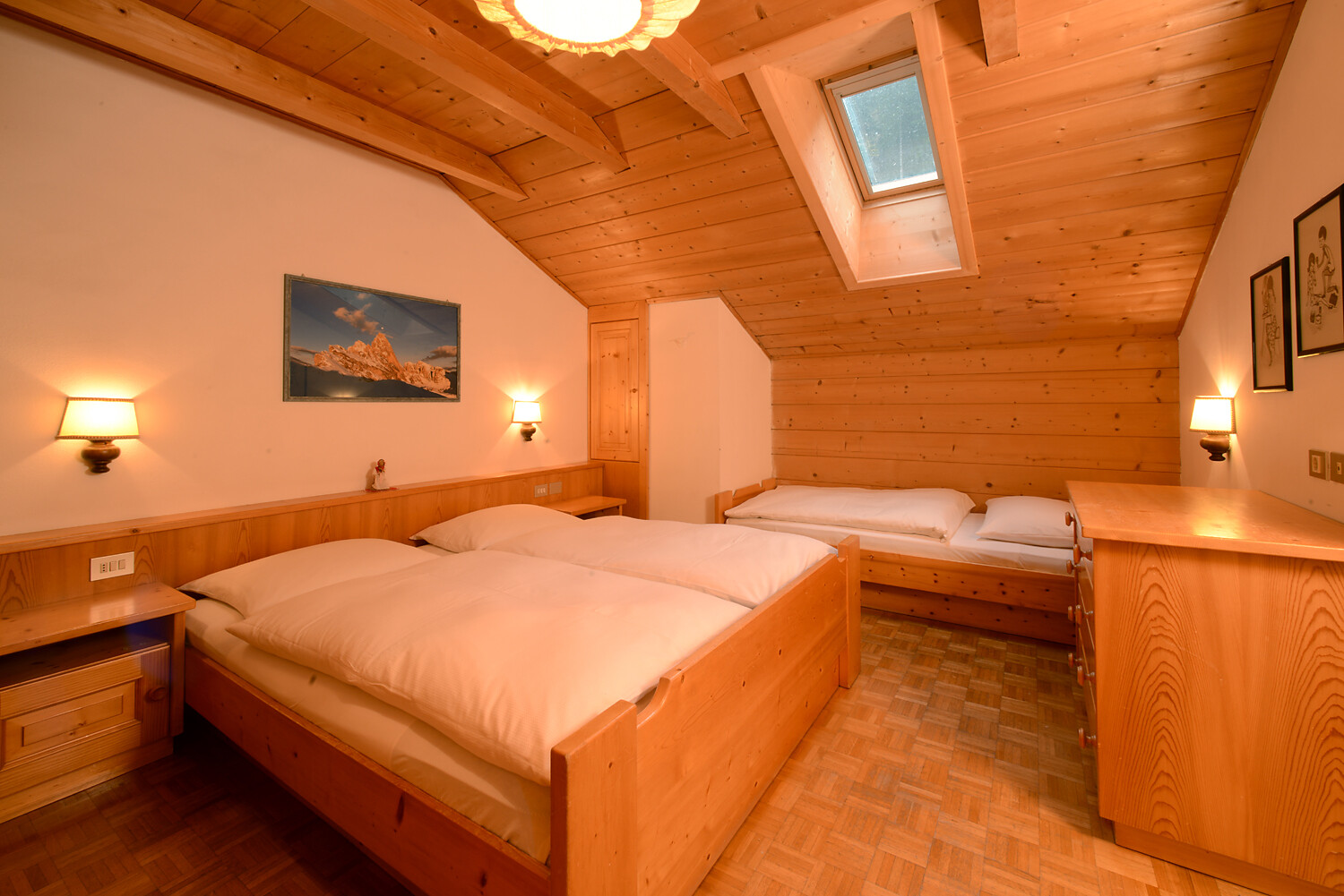 bedroom with additional single bed and balcony A