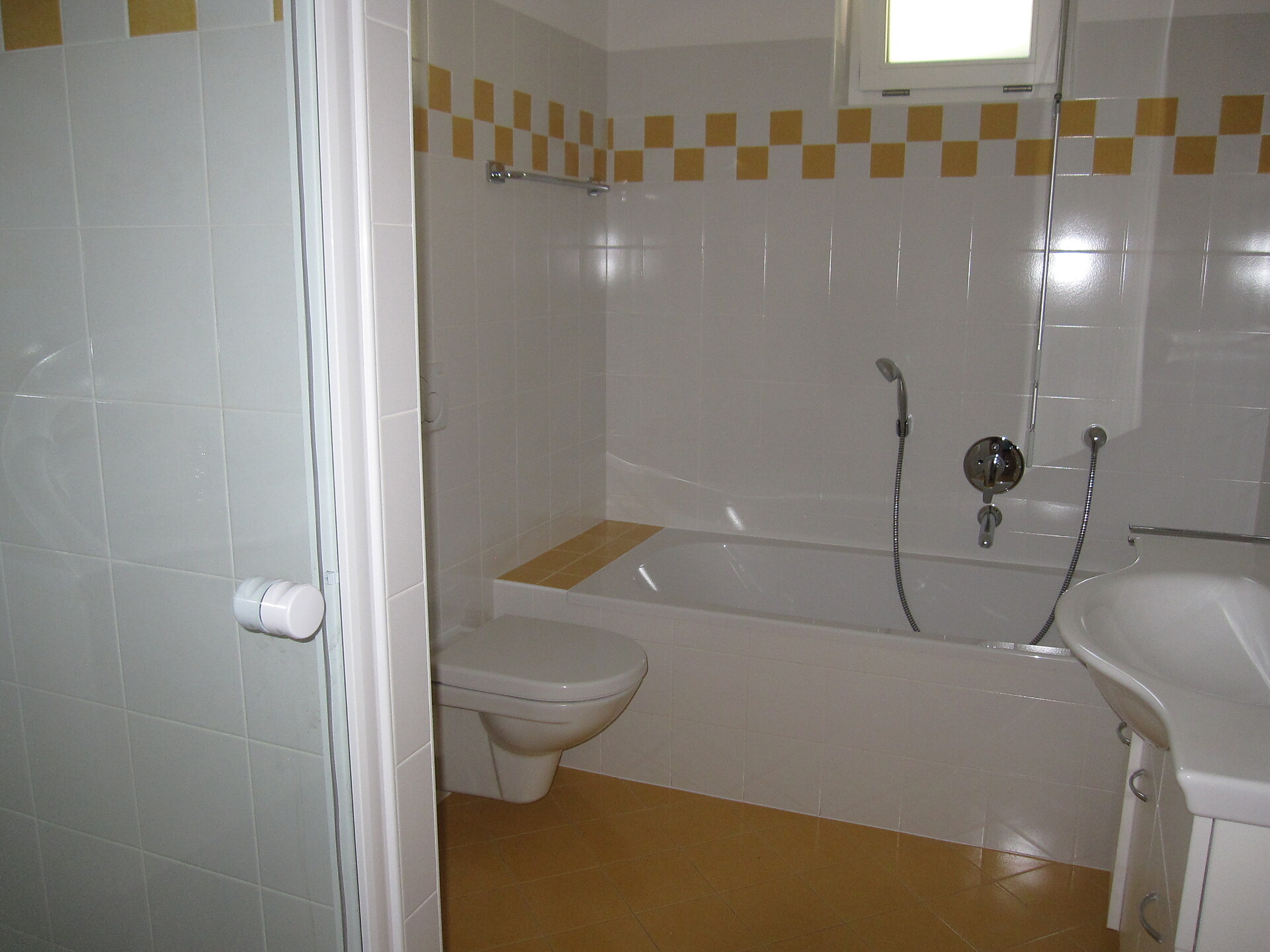 bathroom with shower and bathtub