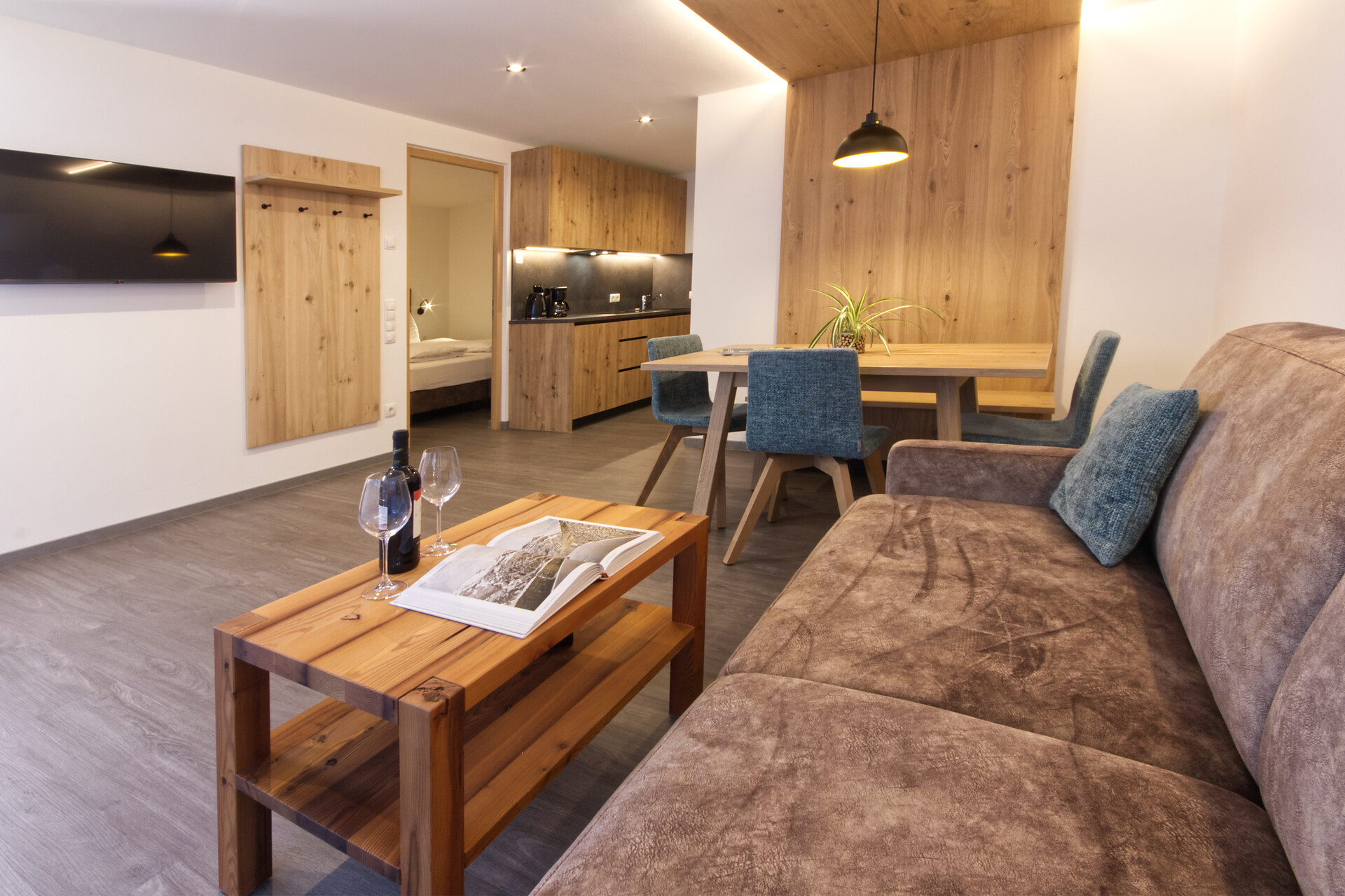 living room with sofa, dining table and kitchen
