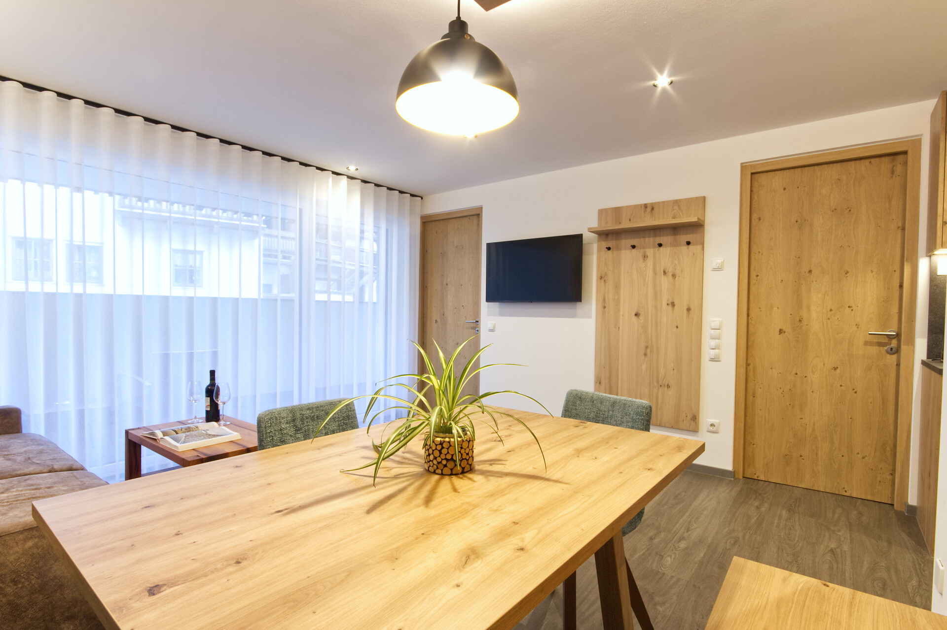 living room with dining table and loggia