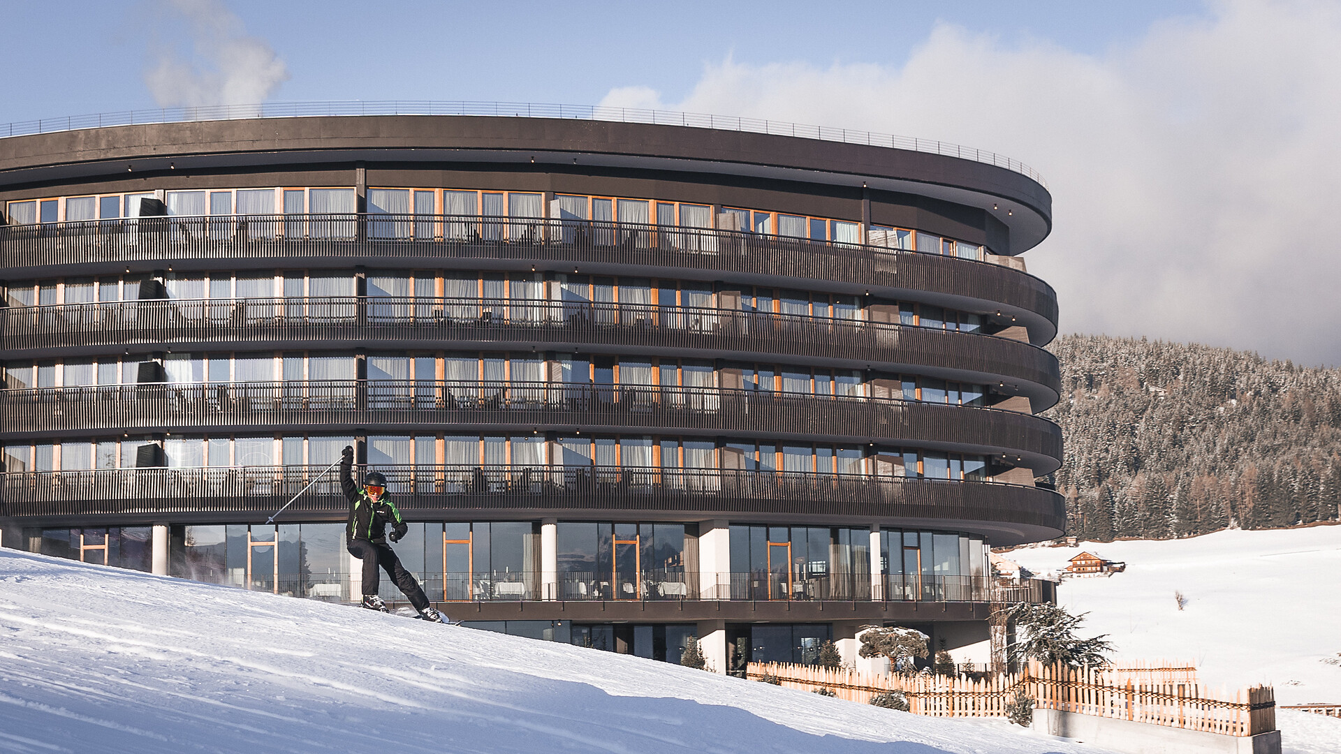 Skier in front of the hotel