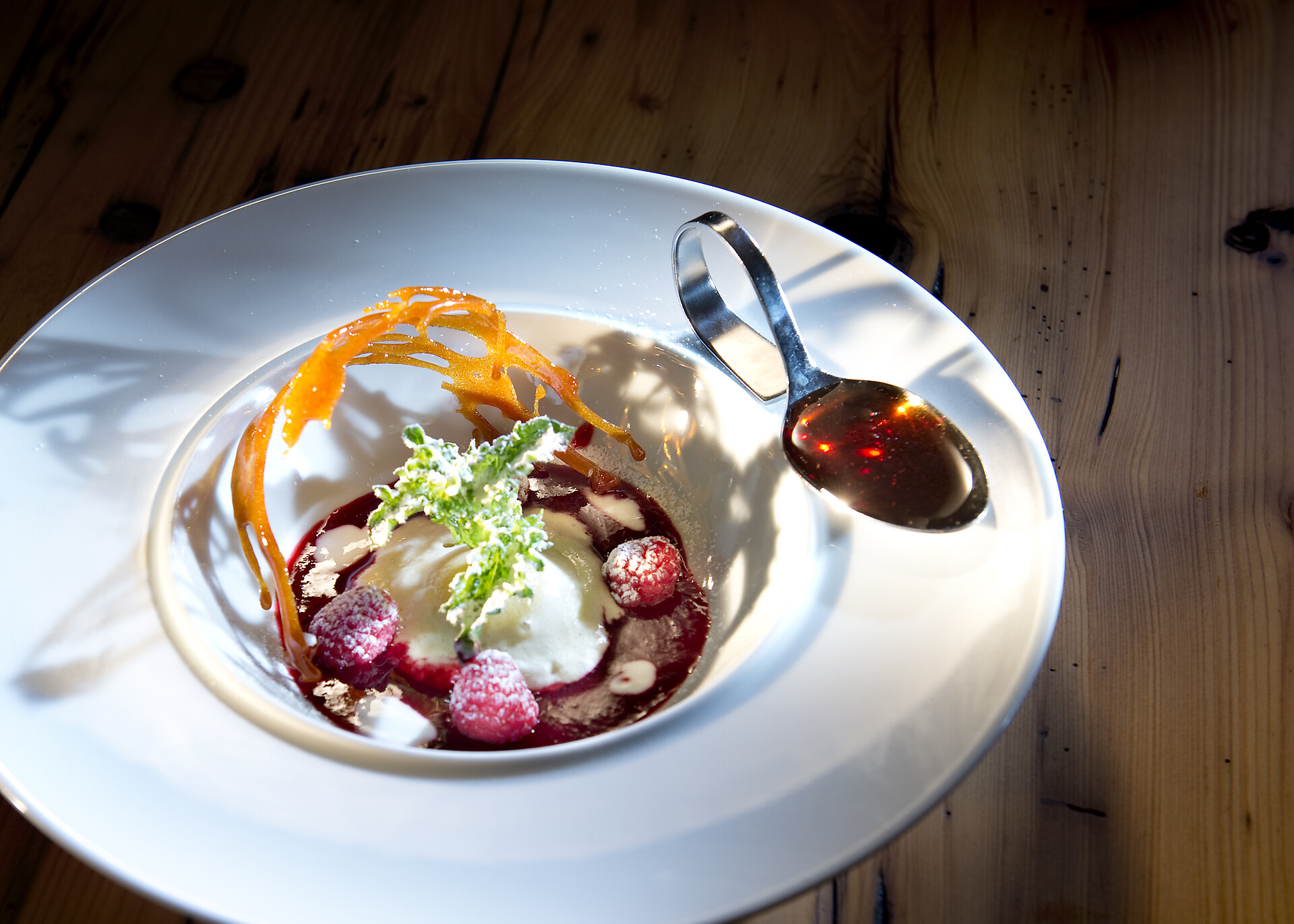 Raspberry sorbet with a spruce honey sauce