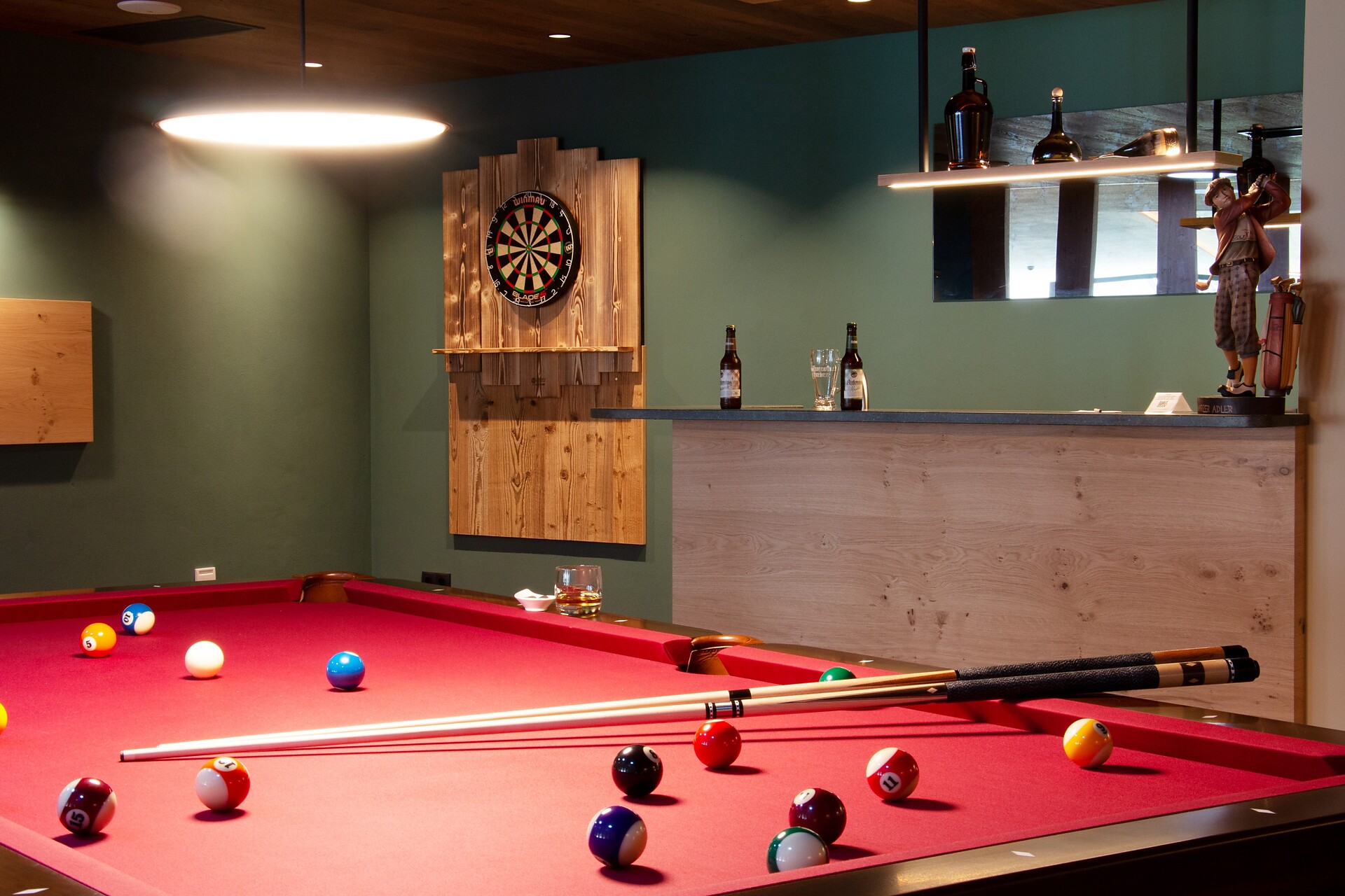 Hotel pub with dartboard and billiard table