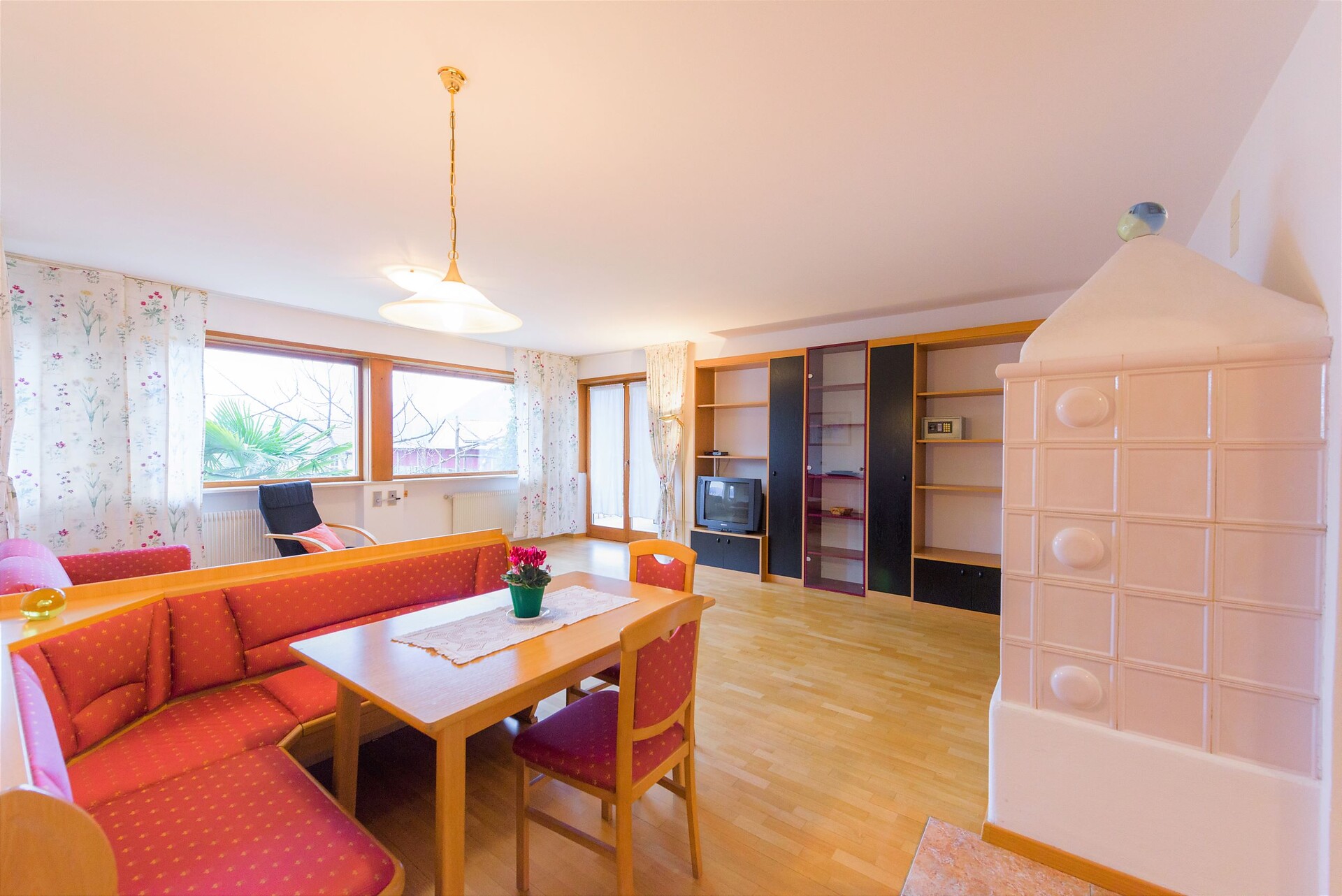 Living room with dining area, double sofa bed and door to terrace and garden nr 9