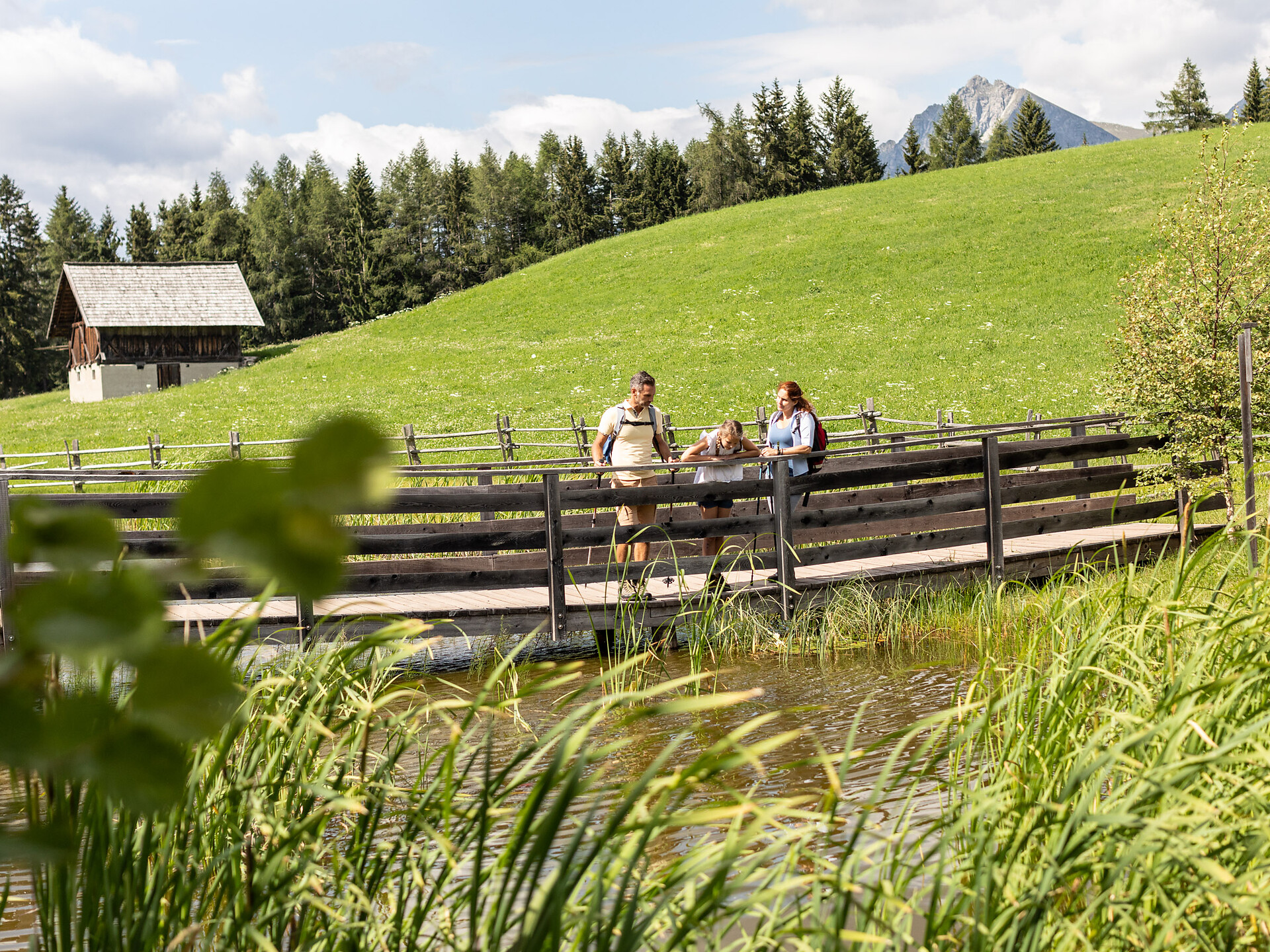 Bruggen pond under the Leadner Alm Mountain Hut