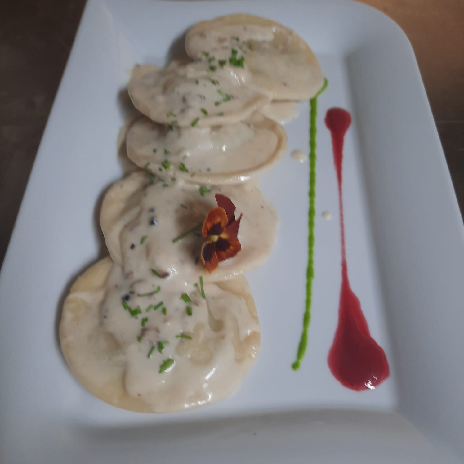 Home made ravioli with waldnut and cream sauce