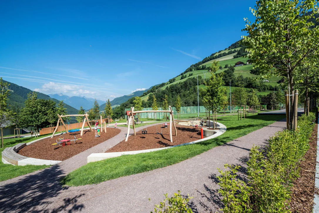 Recreation area with playground at the center of Lüsen