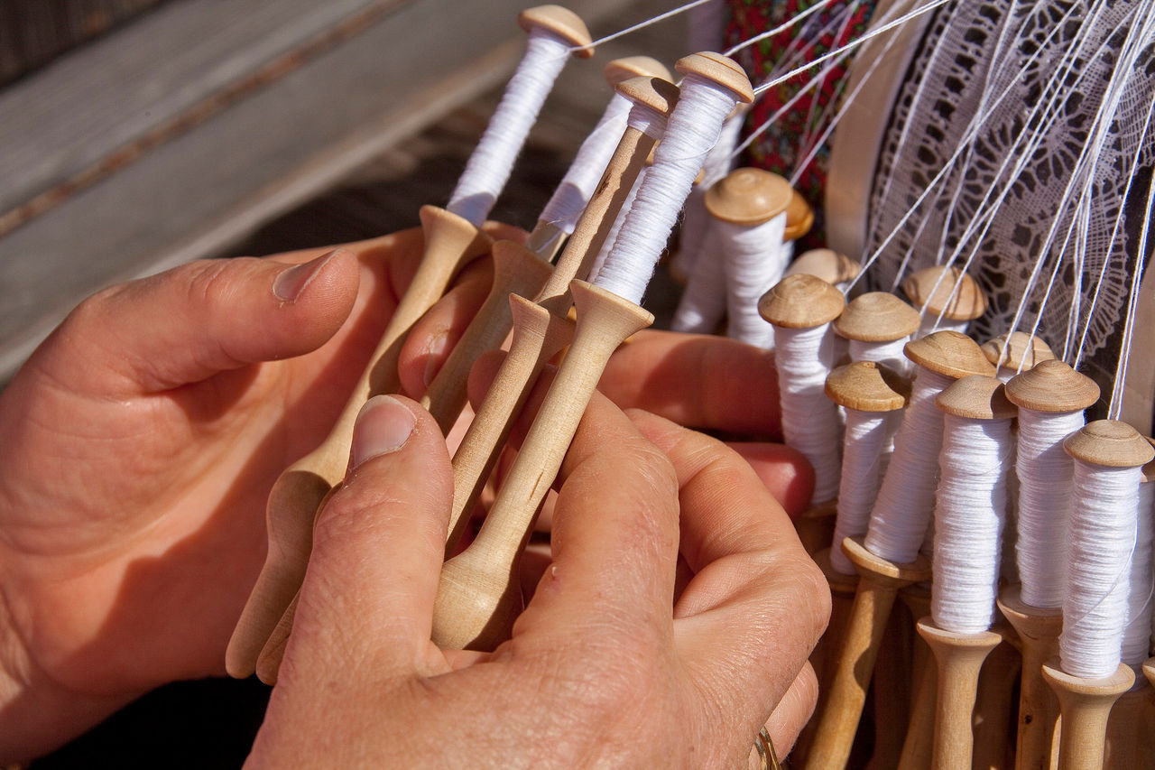 Someone working with a spinning wheel