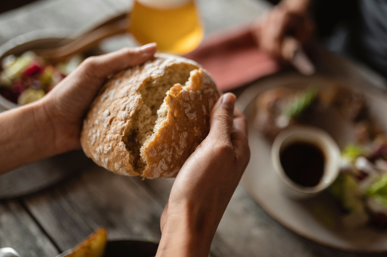 One person shares a loaf of South Tyrolean bread